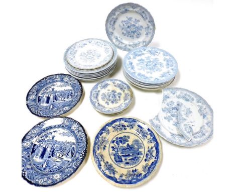A group of early 19thC transfer printed blue and white pottery plates, including Asiatic Pheasant, Midwinter Landscape, and C