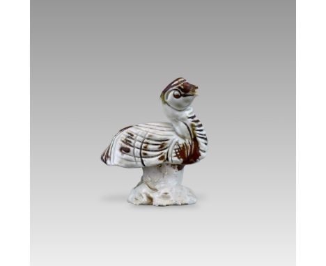 modelled in the form of a goose with cross-hatched incised plumage, covered in a transparent pale blue glaze liberally splash