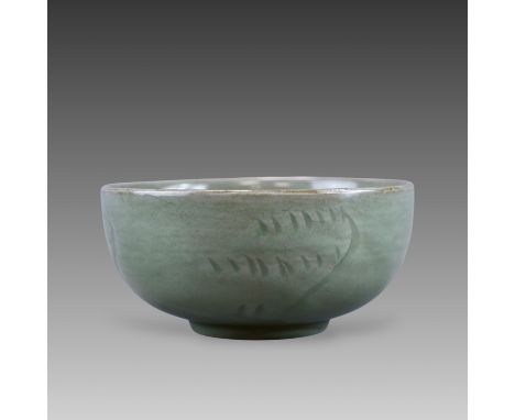 the interior decorated with an incised lotus blossom amongst wavy flourishes, the exterior with further incised abstract deco