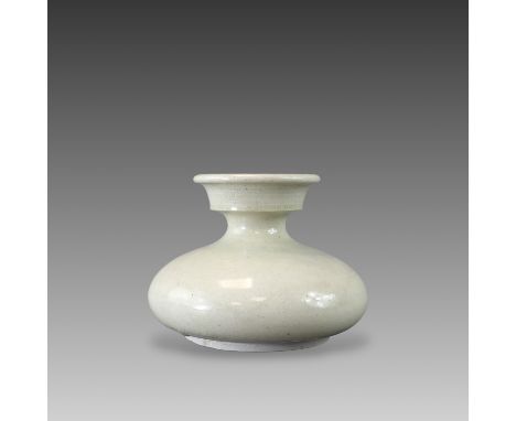 the compressed globular body surmounted by a stepped neck rising to the flared rim, all covered in a white glaze stopping sho