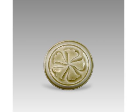 with the drum-form body rising from a flat base centred with a countersunk circular section, the slightly domed cover carved 