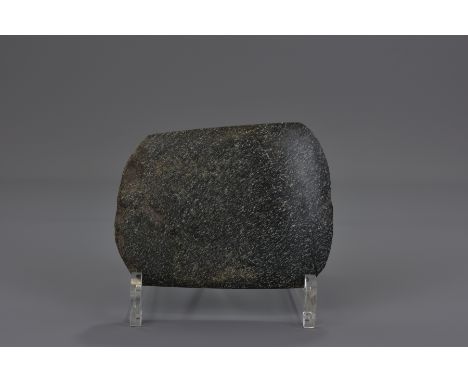 A Chinese Neolithic stone axe head. 10x12cm