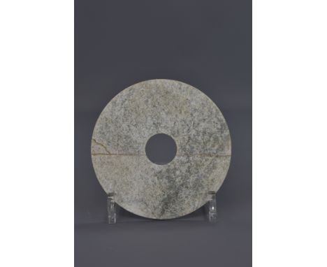 A Chinese Han Dynasty jade disc. 14cm diameter