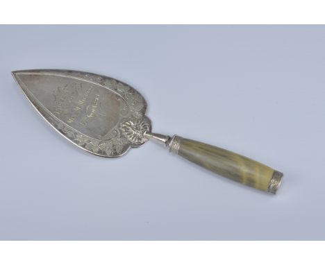 An English antique presentation trowel with horn handle dated 17th April 1894. Length 27cm
