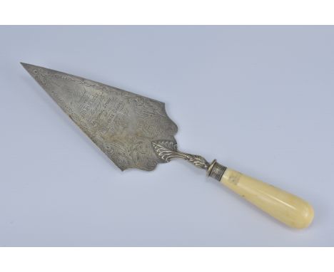 An English antique presentation trowel dated 5th October 1875. Length 30cm