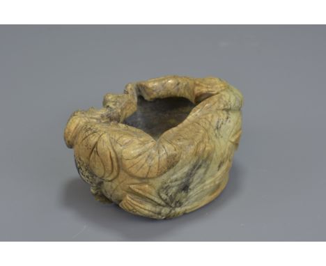 A Chinese Song/Ming Dynasty calcifiednephrite jade brush washer incised with four character mark. 6X7cm