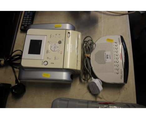 A Roberts alarm clock; radio and a Canon printer
