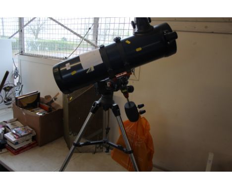 A telescope on tripod stand