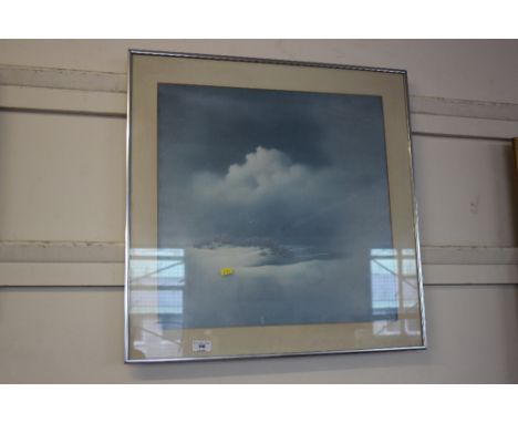 A framed print depicting a shore line 