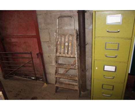 A wooden and metal step ladder 