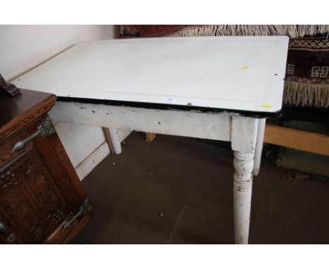 An enamel topped pine table