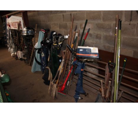A bundle of long handled garden tools 