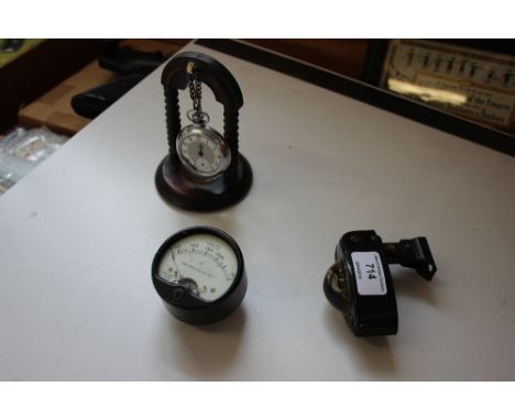 A compass with voltage meter and Smith's pocket watch 