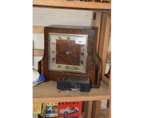 Oak cased mantel clock together with a small transistor radio