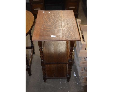 An oak occasional table with turned legs and shelf beneath