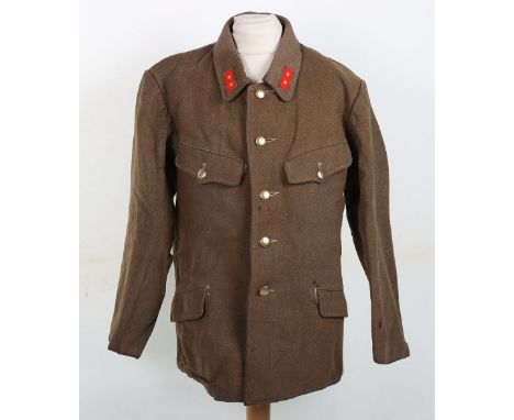 WW2 Japanese Army Combat Tunic, being the four pocket coarse khaki wool combat tunic (winter type) with rank patches to the c