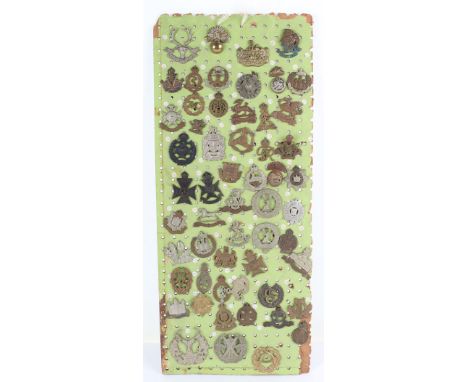 Board of British Military Cap Badges, including Gloucestershire regiment, Artists Rifles, 8th Irish Battalion Kings Liverpool