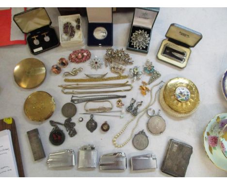 A mixed collection to include costume jewellery, silver cigarette/card case, silver fob, coins, lighters and compactsLocation