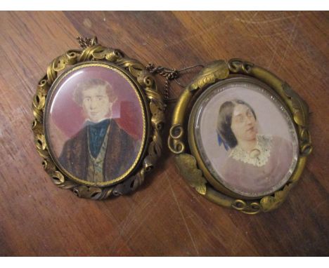 Two Victorian gilt brooches each set with a portrait, one rotating the other with a lock of hair to the reverseLocation: Cab 