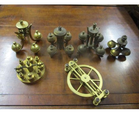 Four anniversary clock ball weights and other clock parts 