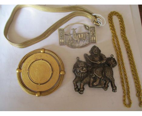 A Chinese white metal brooch, 6cm x 6cm, weight 22.7g, together with a silver Eastern brooch 6cm x 4cm, weight 10.7g, stamped