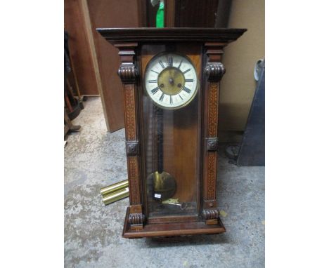 A late 19th century inlaid walnut cased Vienna style clock 