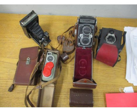 Cameras to include a Yashica 635, a Coronet twelve 20, an Eumig cine camera, filter and accessories. Location:RWB 
