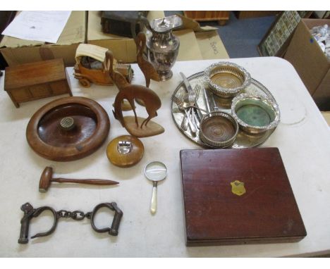 A collection of treen items to include a model of Le Zebre car, a miniature coffer, a gavel, together with a pair of cast iro