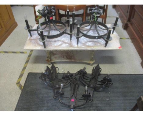 Light fittings to include a pair of wrought iron chandeliers and five matching wall lights 