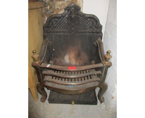 A brass and cast iron fire grate with ornate back, along with a brass fire fenderLocation: G 