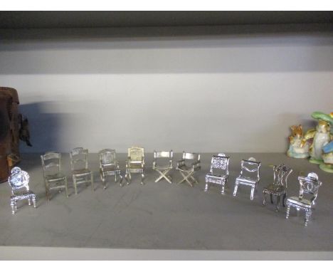A collection of eleven silver plated miniature dolls house furniture/ornamentsLocation: 6:2 
