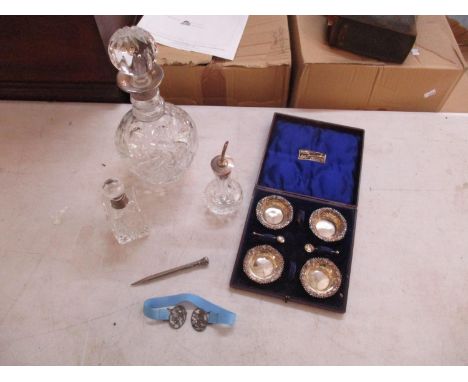 A set of four silver salts in original box, lacking two spoons, together with a crystal decanter with silver collar, crystal 