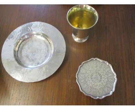 A hammered silver shallow bowl together with a silver pedestal plate with Eastern inscription and a small silver pedestal cup