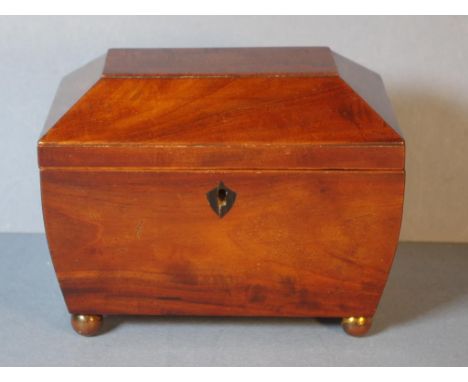 Late Georgian flame mahogany tea caddy with 2 lidded compartments and ebony escutcheon, 20.5cm wide, 16cm high, 13cm deep app