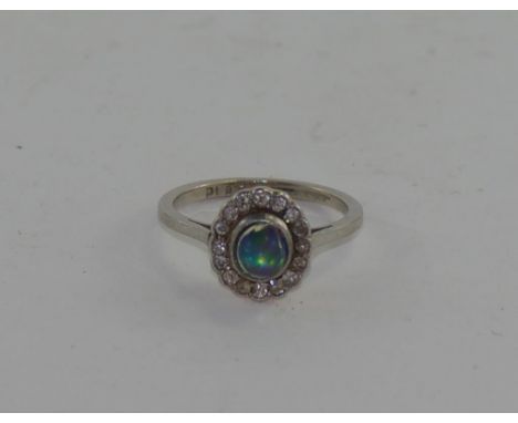 18ct platinum opal and diamond child's ring weight 2.1grams approx in totalsizeE/2-3, in original box