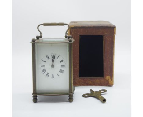 French carriage clock 14cm high, requires servicing, key and travelling case included