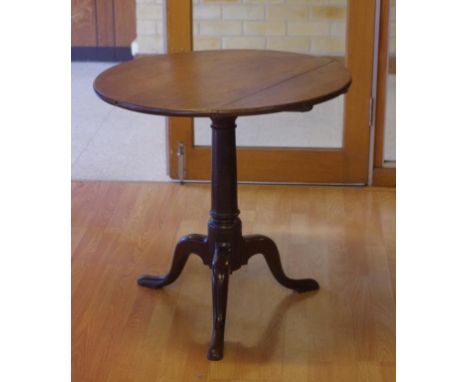 George III English oak tripod table with gun barrel pedestal, circa 1765, 71cm diameter, 70cm high approx