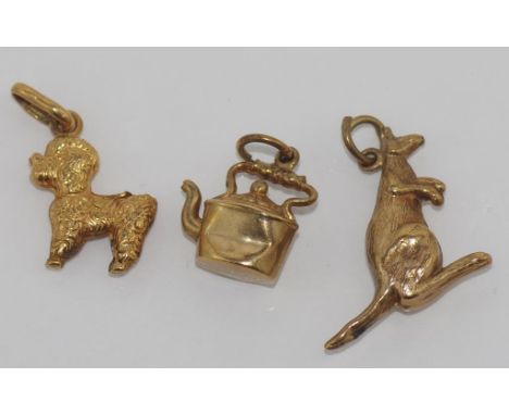 Three vintage gold charms two 9ct, Kangaroo and Kettle, both with Birmingham hallmarks (some dents), the other a poodles mark