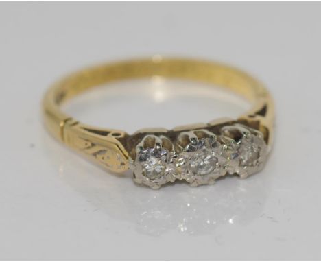 18ct yellow gold and diamond ring illusion set with three small stones, size 5-6/K, total weight 2.9gms.