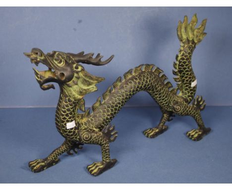 Chinese bronzed dragon figure bronzed finish over ceramic body of rearing dragon. No marks evident. Some loss of bronzed surf