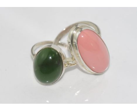 Two silver stone set rings one with nephrite jade and the other a pink stone, sizes: O-P/7-8