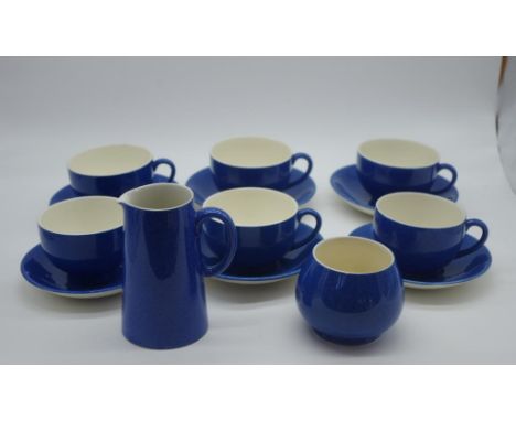 Moorcroft powder blue teaset comprising of 6 cups with saucers, a milk jug and sugar bowl, circa 1920s