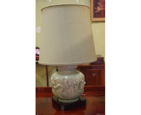 Large oriental celadon base electric lamp with raised dragon decoration, 86cm high