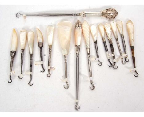 Group of two stamped sterling and mother of pearl handled button hooks, 20cm long together with thirteen mother of pearl and 