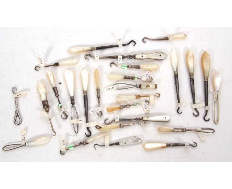 A group of six Victorian mother of pearl handled and silver button hooks together with one Edwardian example, 5-7cm long toge