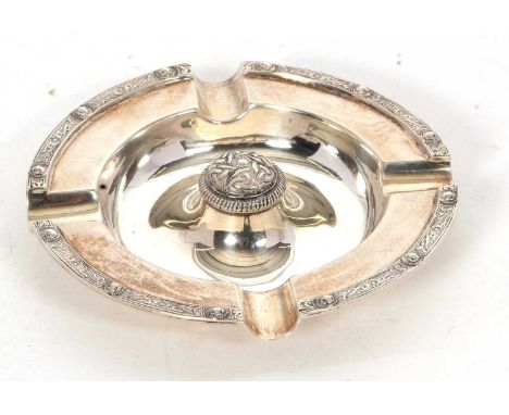 A George VI silver ashtray of circular form having a Celtic design dome centre and border, 12cm diameter, hallmarked for Birm