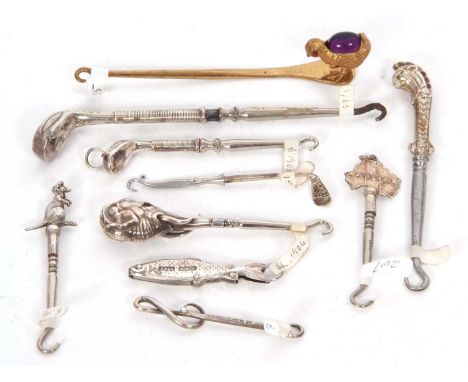 A group of ten novelty button hooks to include three hallmarked silver golf club examples, Birmingham 1907/08 and one sterlin