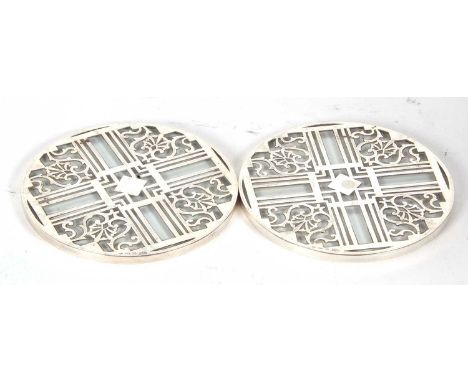 Two matching vintage pierced silver and glass teapot stands, hallmarked for Birmingham 1939/40, makers mark for Mappin &amp; 
