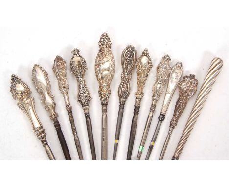 Group of eleven late 19th/early 20th Century silver handled button hooks, various dates/makers, 17-29cm