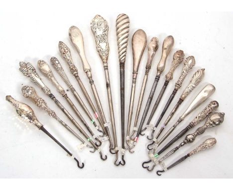 Group of eighteen mainly early 20th Century silver and steel button hooks, various dates/makers together with a later sterlin